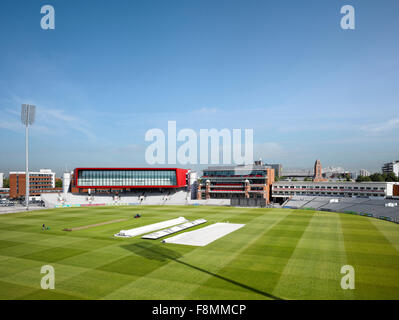 Lancashire County Cricket Club, Manchester. The pitch and playing wicket with covers on at Lancashire County Cricket Club ground. Stock Photo
