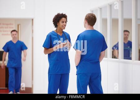 Doctors having discussion in hospital Stock Photo