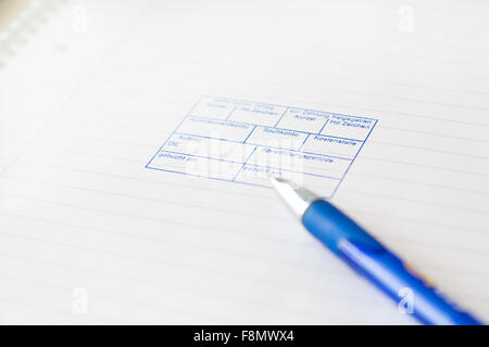 Lined paged with a blue stamp. Pen on the side. Stock Photo