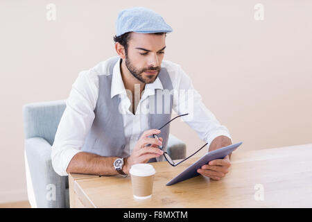 Focused man using tablet Stock Photo