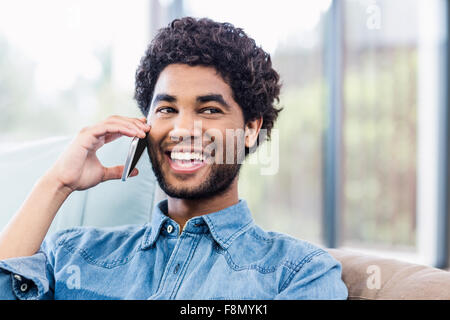 Handsome smiling man on phone call Stock Photo