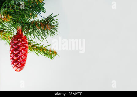 Red artificial Christmas cone on white background Stock Photo - Alamy