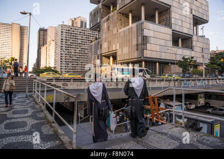 Street scene with two young monks, Largo da Carioca with Petrobras Building, Rio de Janeiro, Brazil Stock Photo