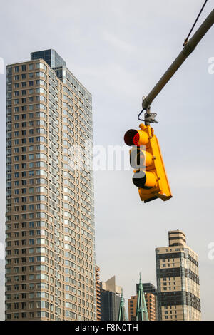semaphore with skyscrapers in the background in Midtown Manhattan Stock Photo