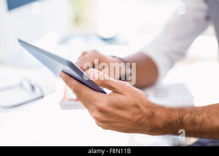 Close up of man using tablet Stock Photo