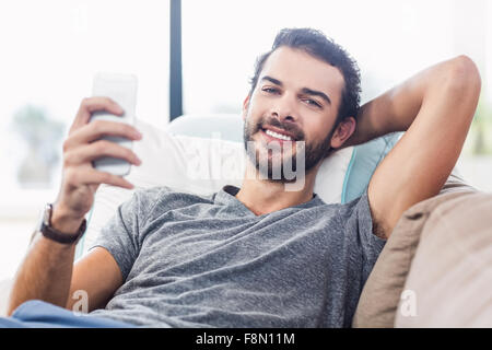 Attractive man using smartphone Stock Photo