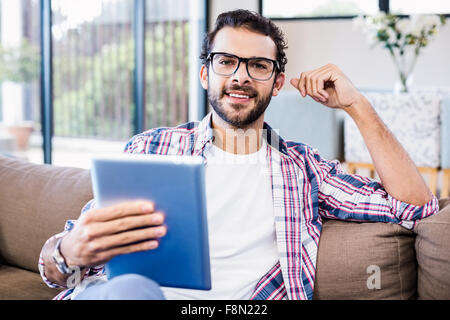 Smiling man using tablet Stock Photo