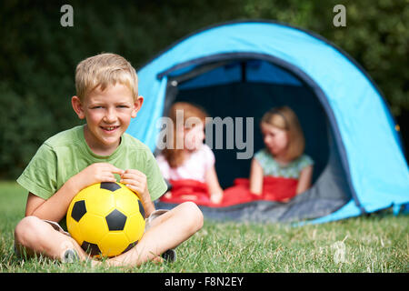 Portrait Of Boy With Friends On Camping Trip Stock Photo