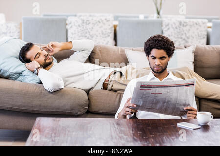 Gay couple in living room Stock Photo