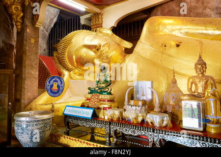 Thailand - Khao Yoi Buddhist Cave Temple, Big Reclining Buddha statue inside Stock Photo