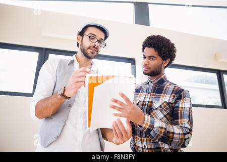 Focused gay couple working Stock Photo