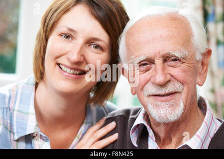 Senior Man With Adult Daughter At Home