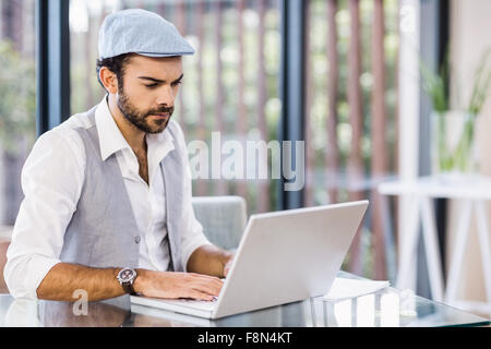 Focused man using laptop Stock Photo