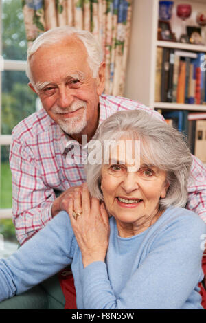 Affectionate Senior Couple At Home Together Stock Photo