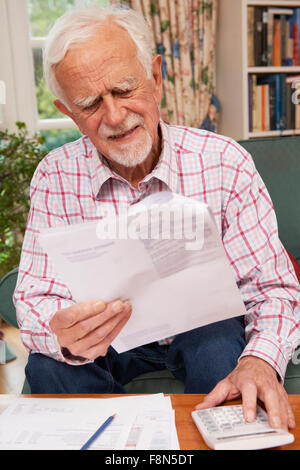 Senior Man Going Through Finances Looking Worried Stock Photo