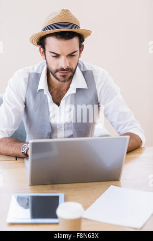 Focused man using laptop Stock Photo