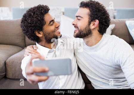 Happy gay couple taking selfie Stock Photo