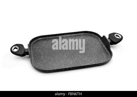 a non-stick iron cast grill pan with two handles on a white background Stock Photo