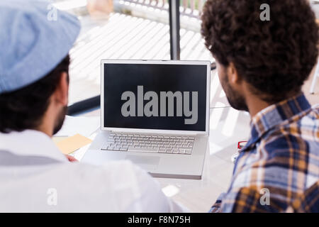 Gay couple using laptop Stock Photo