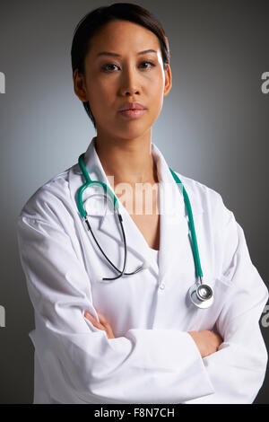 Studio Portrait Of Doctor With Stethoscope Stock Photo