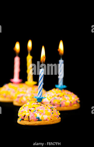 Cupcakes and candles isolated on the white background Stock Photo