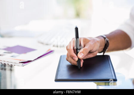 Close up of man using digital board Stock Photo