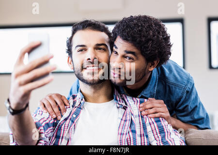 Happy gay couple taking selfie Stock Photo