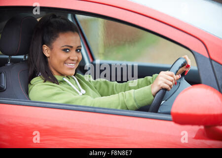 Newly Qualified Teenage Girl Driver Sitting In Car Stock Photo