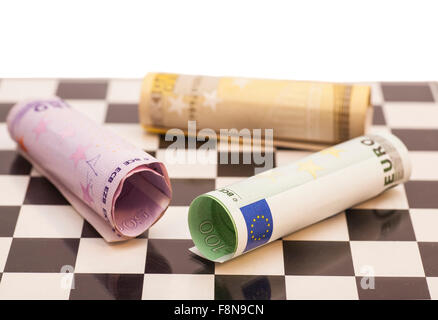 Euro banknotes on chess board Stock Photo