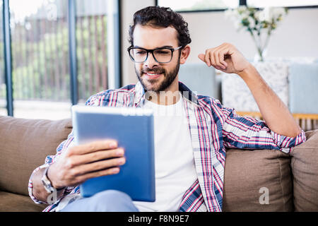 Smiling man using tablet Stock Photo