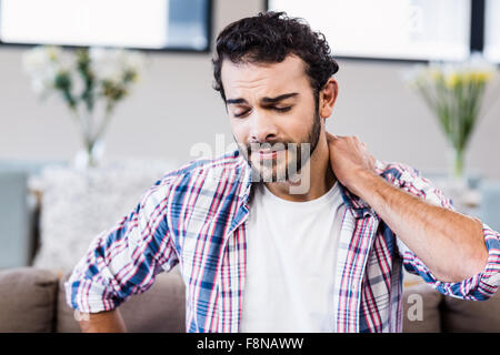 Suffering man with stiff neck Stock Photo