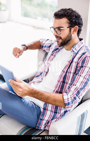 Smiling man using tablet Stock Photo
