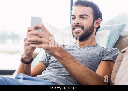 Handsome man using smartphone Stock Photo