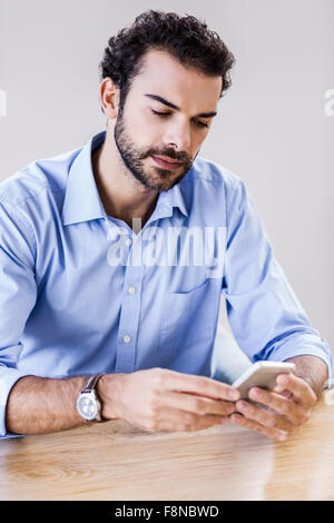 Handsome man using smartphone Stock Photo