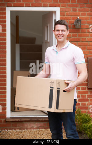 Young Man Moving Into New Home Stock Photo