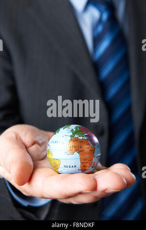 Businessman man hand holding Earth icon , digital globe Stock Photo - Alamy