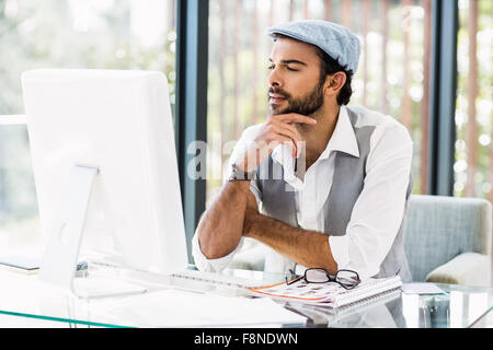 Focused man working on computer Stock Photo