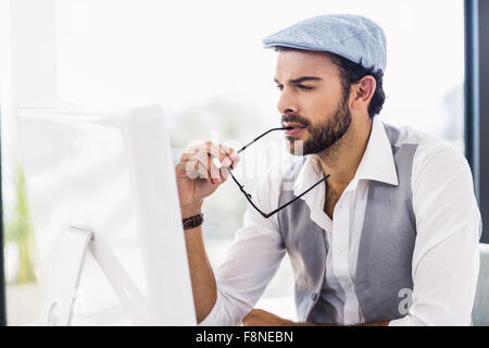 Focused man working on computer Stock Photo