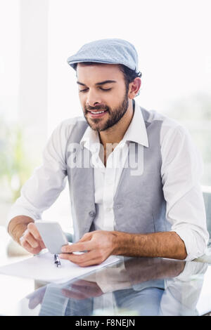 Smiling man using smartphone Stock Photo