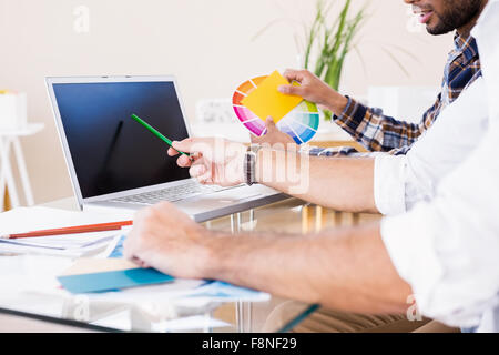 Gay couple working on laptop Stock Photo