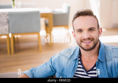 Handsome man smiling at camera Stock Photo