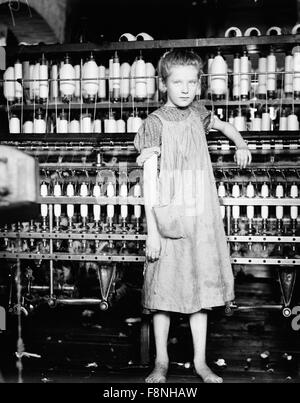 LEWIS HINE (1874-1940) American photographer and sociologist. One of his child labour photos taken in 1910. Original captions reads: 'Addie Card, 12 years. Spinner in North Pormal (i.e., Pownal) Cotton Mill. Vt. Girls in mill say she is ten years. She admitted to me she was twelve; that she started during school vacation and new would 'stay.' Stock Photo