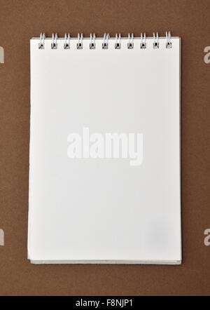 Blank notepad with spiral bound on top Stock Photo
