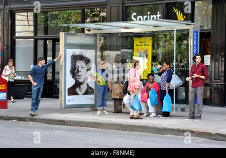 A Chuck Close painting is reproduced on an outdoor advertising panel at a bus shelter in New York City during the Art  Everywhere event. Stock Photo