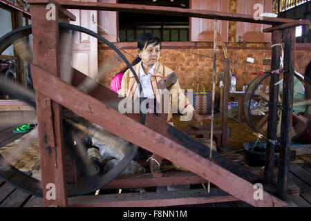 Myanmar hand-loom woman.The Padaung people are one of the many minority tribes in Myanmar. Padaung women are known for weaving o Stock Photo