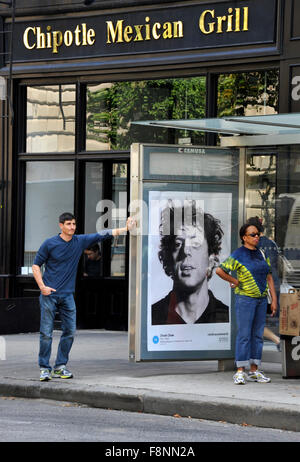 A Chuck Close painting is reproduced on a bus shelter advertising panel in New York  City as part of the Art Everywhere event. Stock Photo