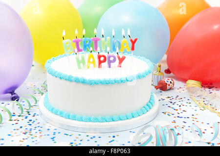 Celebration Cake With Candles Spelling Happy Birthday Stock Photo