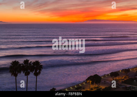 Sunset surf sets rolling in to the Ventura California coast. Stock Photo