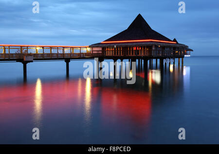 The Bodega del Mar over-water bar and restaurant in Anse Vata Bay is a cornerstone of Noumea's nightlife. Stock Photo