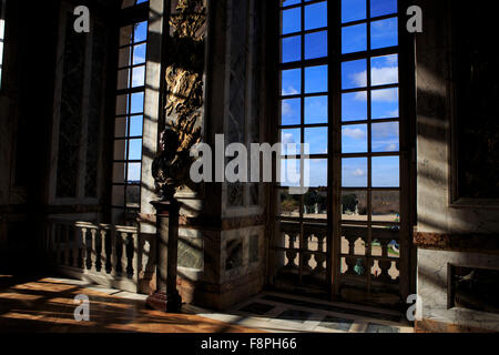 Bright sunlight casts shadows out of door and window frames in the giant Hall of Mirrors in the Chateau Versaille, Paris, France Stock Photo